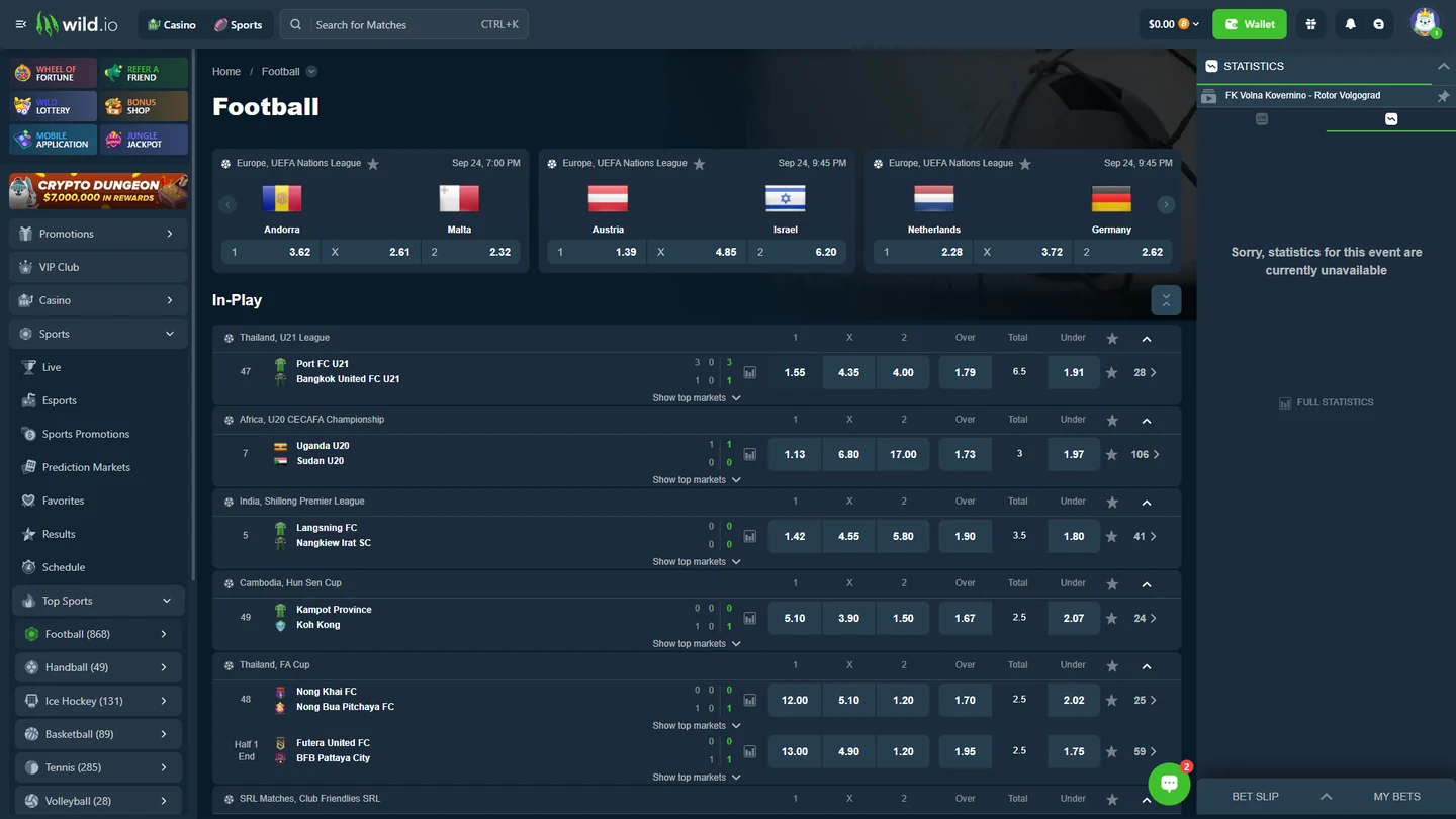 Interface de sportsbook da Wild.io com mercados de futebol e apostas ao vivo